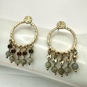 Gold tone green stones dangling earrings
